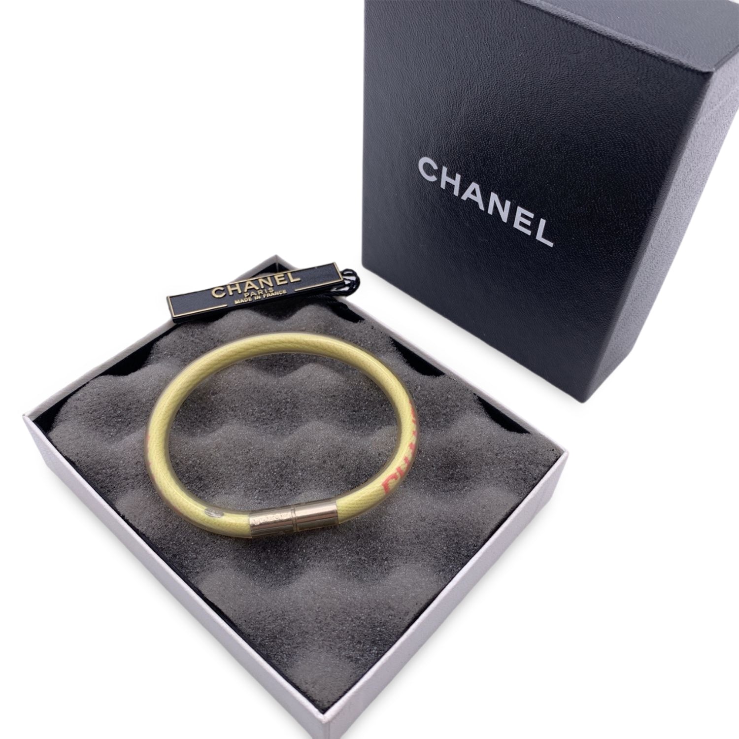CHANEL LUCITE & GOLD LETTERED C H A N E L CC LOGO BANGLE BRACELET - Petunia  Peacock Vintage Chanel Jewelry
